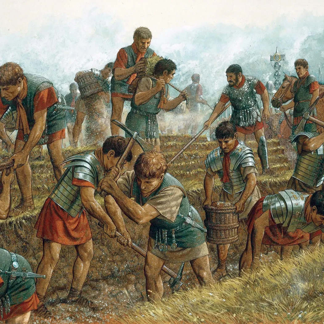 Alesia Kuşatması,
Jül Sezar, Galya'yı (bugünkü Fransa) fethederken, 80.000 kişilik ordusuyla Alesia tepesine kapanan isyancı lider Vercingetorix ile karşılaştı. Sezar doğrudan saldırmak yerine, kasabanın etrafına 18 kilometrelik devasa bir duvar ördürdü. Hedef netti: Düşmanı içerde açlığa mahkum etmek.
Ancak asıl hikâye, dışarıdan devasa bir Galya destek ordusunun geldiğini öğrenince başladı. Çoğu komutan kaçardı ama Sezar imkânsızı yaptı: Dışarıya dönük ikinci bir duvar daha inşa etti! Sezar artık ordusuyla beraber iki duvarın, dolayısıyla iki düşman ordusunun arasına kendi isteğiyle hapsolmuştu. Kuşatmacıyken kuşatılan olmuştu.
İki ateş arasında kalan Romalılar için savaş korkunçtu. Savunmanın çökmek üzere olduğu o en kritik anda Sezar, meşhur kırmızı pelerinini dalgalandırarak bizzat cepheye koştu ve askerlerine cesaret vererek hattı tuttu.
Sonuç mu? Duvarlar yıkılmadı, destek ordusu dağıldı ve Vercingetorix teslim oldu. Sezar koca bir coğrafyayı kılıç darbeleriyle değil; mühendislik, zekâ ve çelik gibi bir sinirle dize getirmişti!